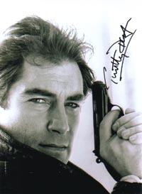 ... pose with gun. A wonderful shot, signed by Timothy Dalton i black in the ... - 3479td